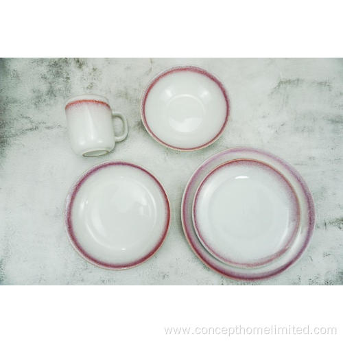 Reactive glazed stoneware dinner set with pink rim